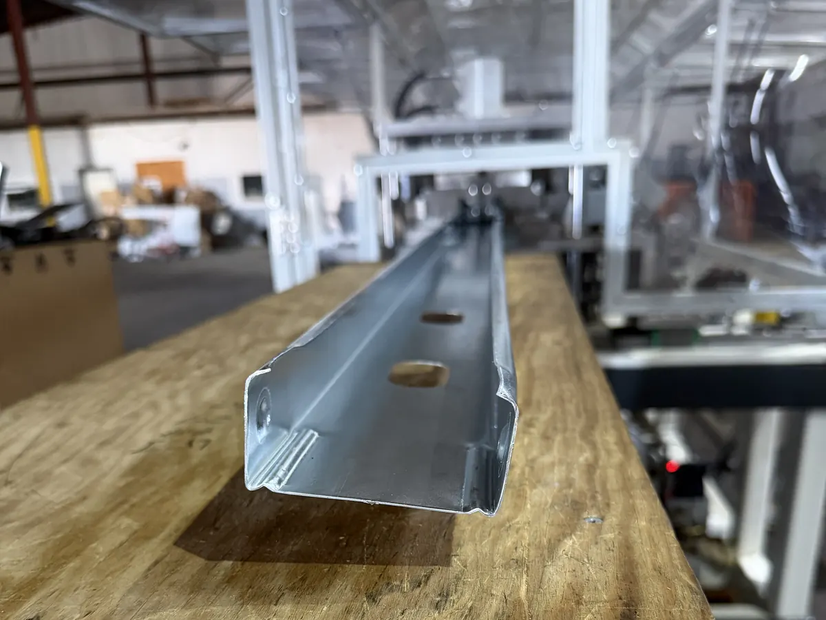 Steel C-stud with a pre-punched service hole